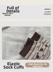 Detail of cute puppy embroidery and brown striped pattern on high elastic ribbed socks