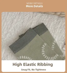 Detail of high-elastic knit sock cuffs in olive green and grey with wave patterns