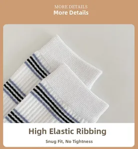 Detail of high-elasticity ribbed cuff on white striped socks for a comfortable fit