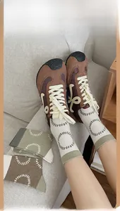 Detailed view of mid-calf cotton socks with unique circle patterns and ribbed cuffs