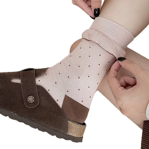Pink polka dot crew socks for women featuring ribbed cuffs and contrast heel design