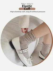 Detail of high elasticity ribbed sock cuff showing stretch performance on a light coffee sock