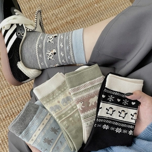 Chaussettes en tricot Fair Isle avec motifs animaux incluant manchots et ours polaires