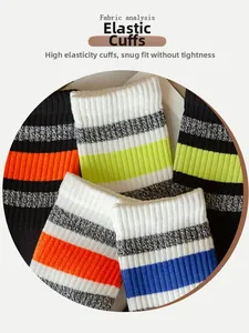 Detail of high-elasticity ribbed cuffs on striped cotton blend crew socks for men