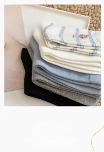 Detail of soft cotton socks with cute cat embroidery and elastic non-slip cuffs