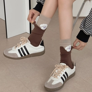 Women's crew socks with cute dog embroidery paired with retro sporty trainers