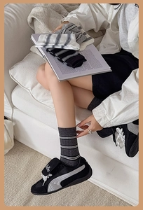 Detail of classic striped knit crew socks in cotton blend featuring soft elastic texture