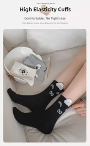 Detail of cute 3D sheep cartoon socks with high elastic cuffs in black and gray tones