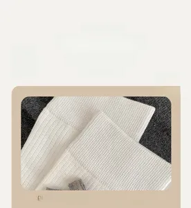 Detail of high-elasticity ribbed cuffs on white lolita socks with soft texture