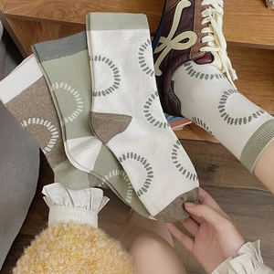 Trend mid-calf knit socks with circular patterns in beige, green, and brown tones