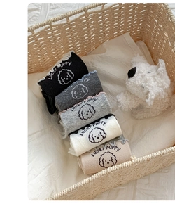 Detail of five-color mid-calf socks set with ruffle edges and cute lucky puppy patterns