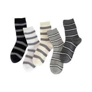 Five pairs of striped cotton crew socks in assorted neutral colors with ribbed texture