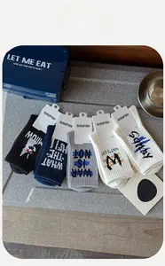 Detailed close-up of 5-pack men's cotton crew socks with stylish graffiti letters