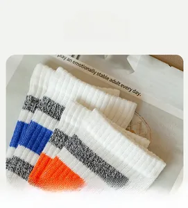 Macro detail of high elasticity ribbed cuff on men's striped cotton athletic socks