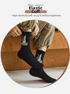 Detail of high-elasticity ribbed cuff on black mid-tube cotton socks with cat pattern