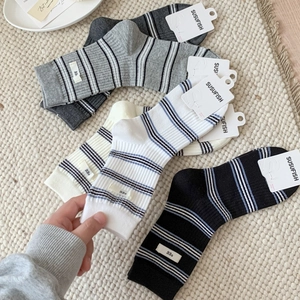 Ribbed cotton mid-calf socks set in grey, black and cream with egg woven label details