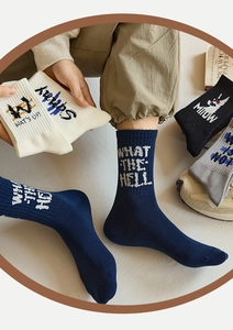 Detailed knit texture of street style mid-calf socks with creative letter patterns