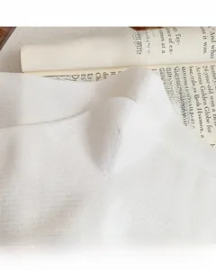 Detailed macro view of reinforced toe and heel stitching on white ribbed cotton socks