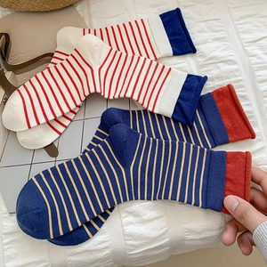 Classic striped crew socks with colorful patchwork rolled cuffs in soft knit cotton