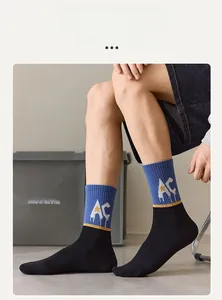 Detail of trendy color-block mid-calf socks with AC letters and yellow star patterns