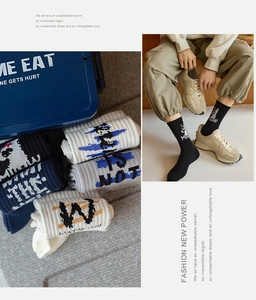 Detail view of cotton crew socks with athletic lettering and retro cartoon motifs