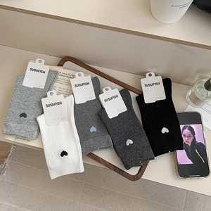 Five pairs of ribbed cotton mid-calf socks with small heart embroidery in neutral tones