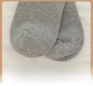 Macro shot of reinforced toe detail on grey ribbed knit socks with durable stitching
