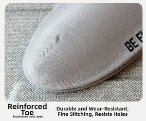 Macro shot of reinforced seamless toe stitching on men's cotton knit sports socks