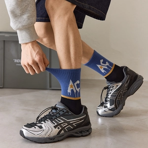 Elastic cotton mid-calf sports socks with AC letter pattern shown on person
