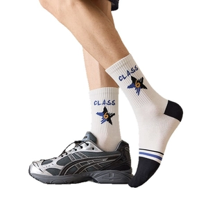 Men's athletic crew socks with CLASS lettering and star motif worn with sports sneakers