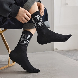Men's black crew socks with white CREW lettering pattern and rib-knit cuffs