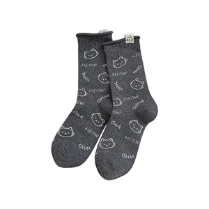 Cute dark gray crew socks with white cartoon cat and meow patterns on white background
