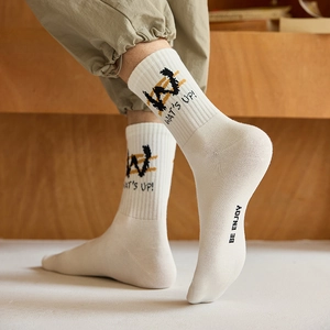 Men's white mid-calf sports socks with street style lettering and ribbed cuffs