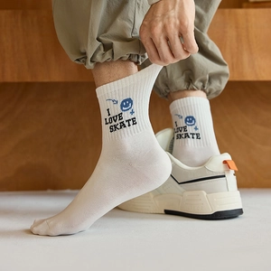 White crew socks with blue smiley face and I LOVE SKATE text for teen boys sports style