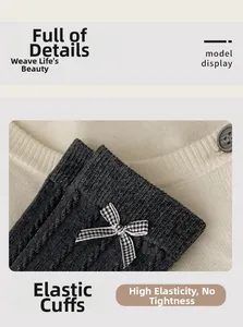 Close-up of grey ribbed knit socks with plaid bow detail and elastic cuffs