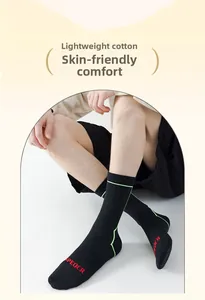 Detail of professional cycling socks with fluorescent green stripes and thin cotton fabric