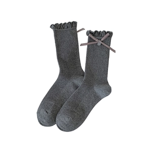 Dark grey rib-knit crew socks with ruffled cuffs, ribbon bows, and decorative buttons