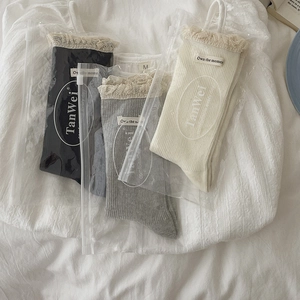 Three pairs of vertical striped lace-trimmed crew socks in black, gray and beige colors