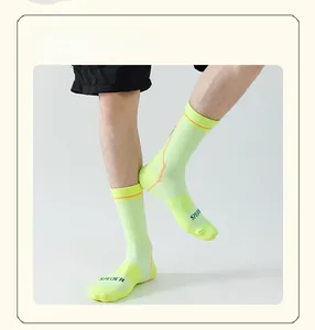Detail of neon cycling socks with soft cushioned sole and breathable knit texture