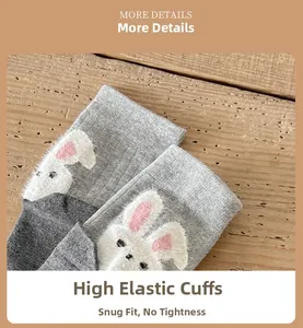 Detail of grey crew socks featuring elastic ribbed cuffs and 3D plush bunny embroidery