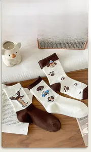 Detailed close-up of soft knit cotton mid-calf socks with cute cartoon dog patterns