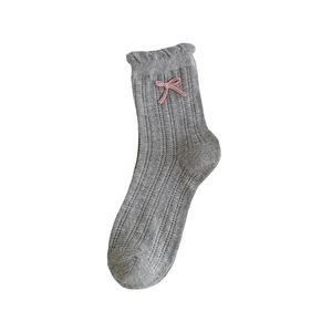 Sweet grey knit socks with pink bow and ruffled lace cuffs in a soft mesh texture