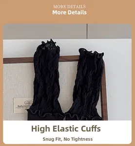 Macro detail of elastic ribbed cuffs with ruffled edges on black ballet style socks