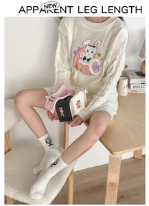Detailed embroidery of cartoon cat on cotton mid-calf socks with knitted sweater