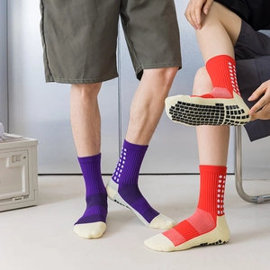 Unisex mid-calf anti-slip soccer socks with silicone grips in purple and red color