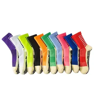 Ten pairs of colorful non-slip soccer socks with checkered patterns and rubber grip soles