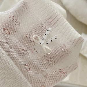 White breathable mesh socks with polka dot bow and cute cartoon character detail