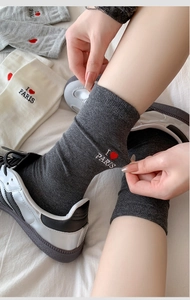 Detail of I Love Paris heart embroidery on cotton ribbed socks with sneakers
