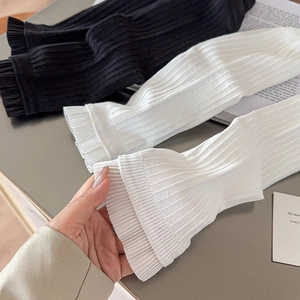 Knit ruffle socks with elastic ribbed texture in black and white minimalist style