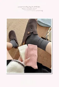Detailed view of women's cotton mid-calf socks with cute cartoon bear pattern embroidery